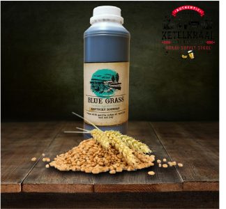 A bottle of "Blue Grass Kentucky Bourbon" flavor essence on a wooden surface with raw grains and wheat ears scattered in front. In the background, a logo for "Ketelkraal Distillery & Braai-Supply Store" is visible on a textured dark backdrop.